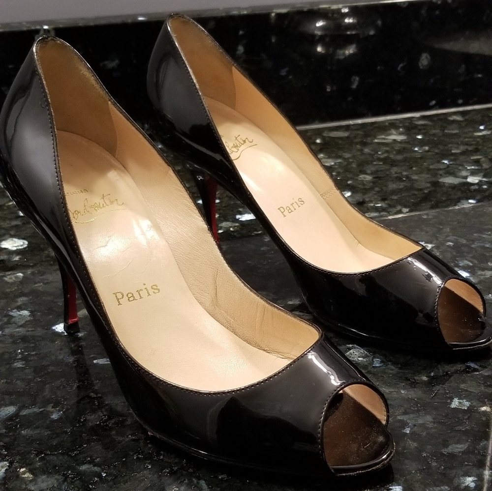 CHRISTIAN LOUBOUTIN classic peep toe heel.